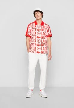 Lacoste X Netflix - Polo - Flour/Corrida -Tenues Mode Boutique ca97031efce646c48d6dd2c0f7319472